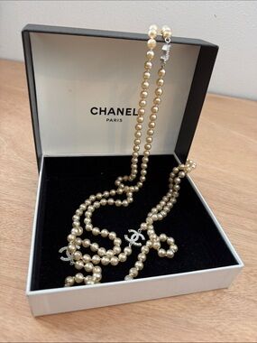 CHANEL Long Pearl Necklace with Silver CC Logos